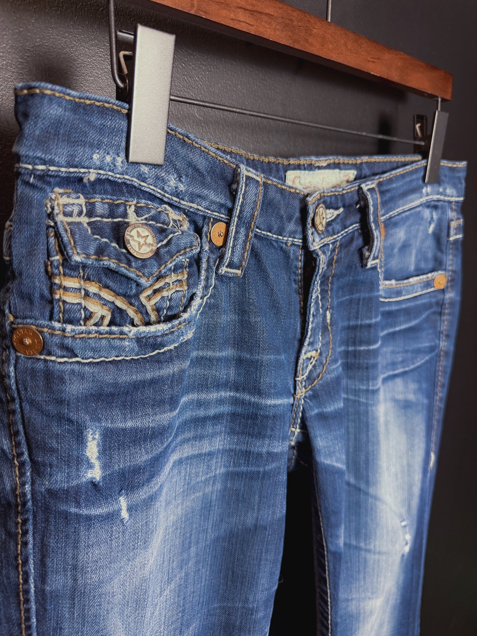 Buckle Low Rise Bootcut Jeans